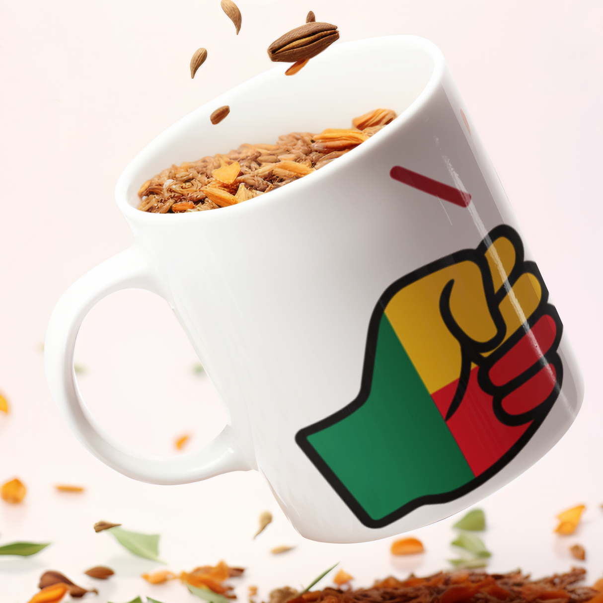 White mug with a We Run Tings Benin flag fist design filled with granola with scattered granola on a light background.
