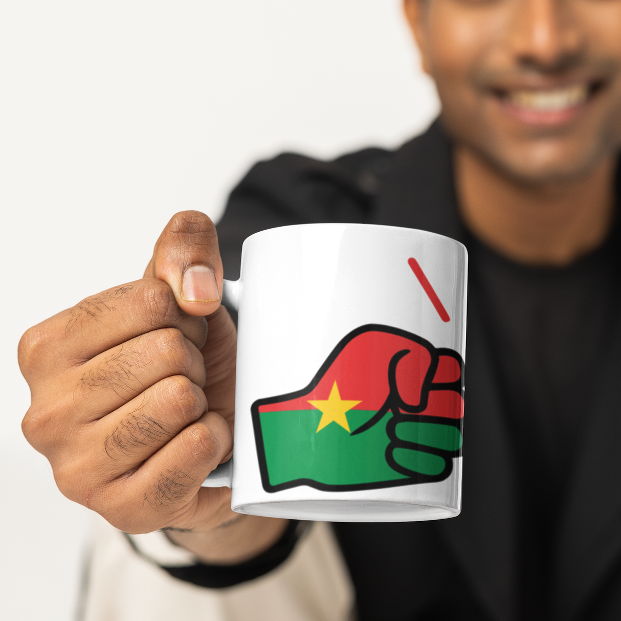 Man holding a mug with a design of a We Run Tings, Burkina Faso Mug. White ceramic glossy cup featuring the flag of Burkina Faso against a white background