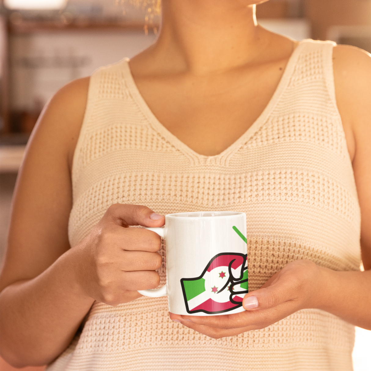 Woman wearing a light-colored sleeveless top holding a mug with We Run Tings Logo and a flag of Burundi design