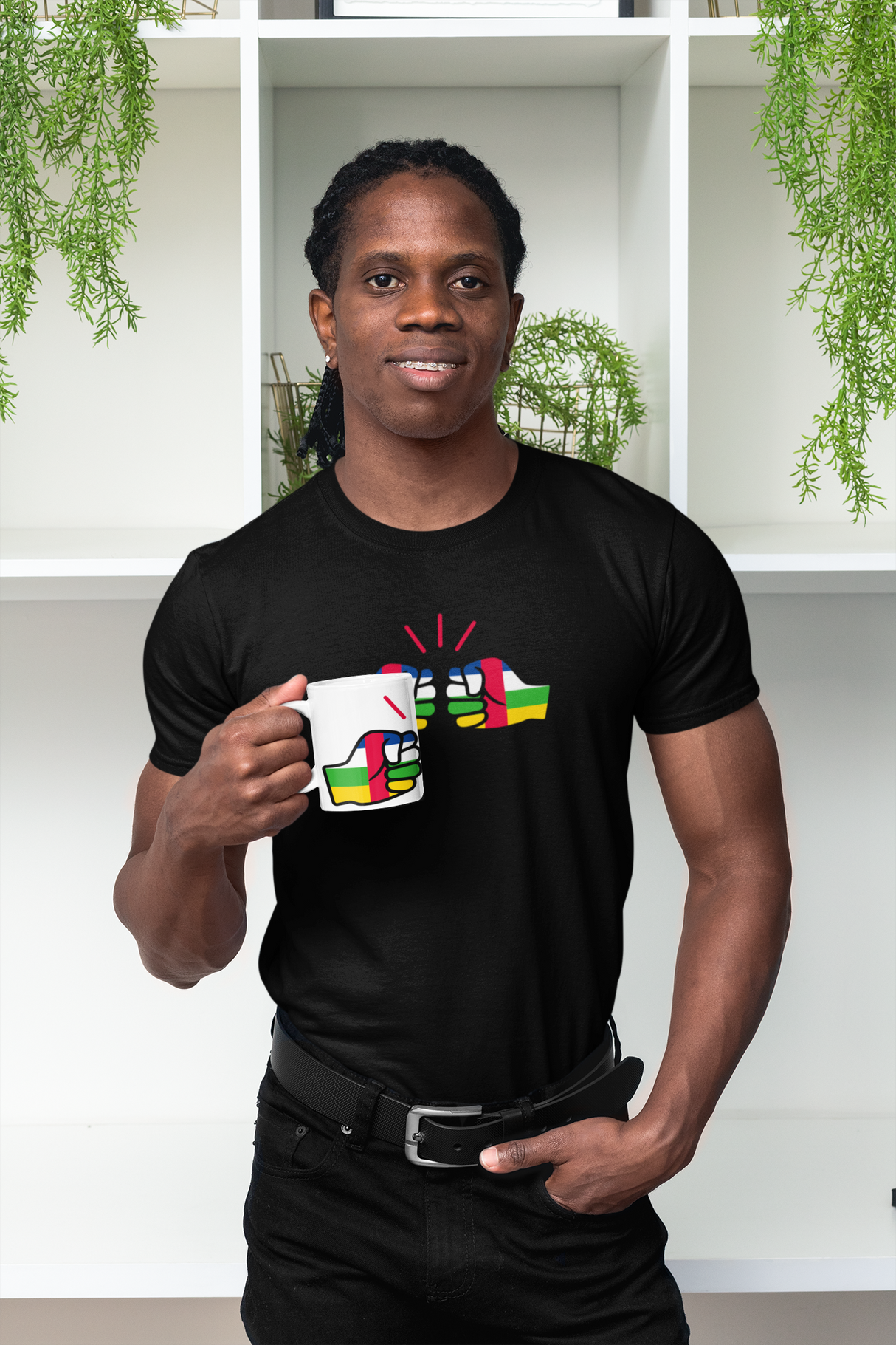 Man holding a white We Run Tings Central African Republic (CAR) Mug and wearing a matching black t-shirt with brand logo.