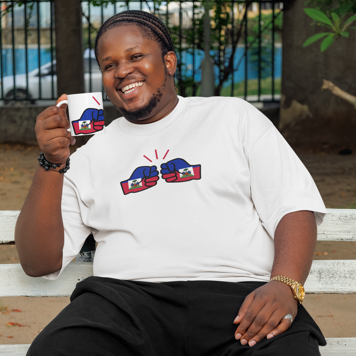 Person sitting on a bench holding a mug with a cityscape background