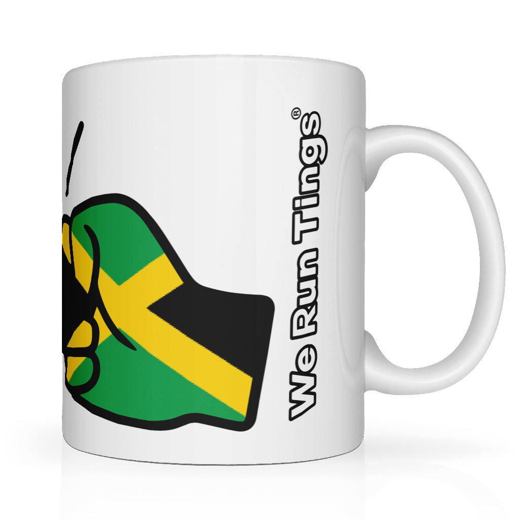 White mug with a green and yellow We Run Tings Jamaica White Ceramic Mug
