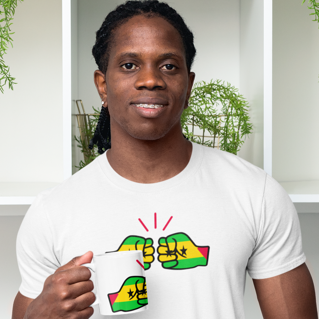 Man wearing a white São Tomé and Príncipe themed t-shirt featuring the We Run Tings Logo, standing indoors with plants in the background and matching We Run Tings mug. Premium white 11oz ceramic mug featuring the flag design. Dishwasher & microwave safe.