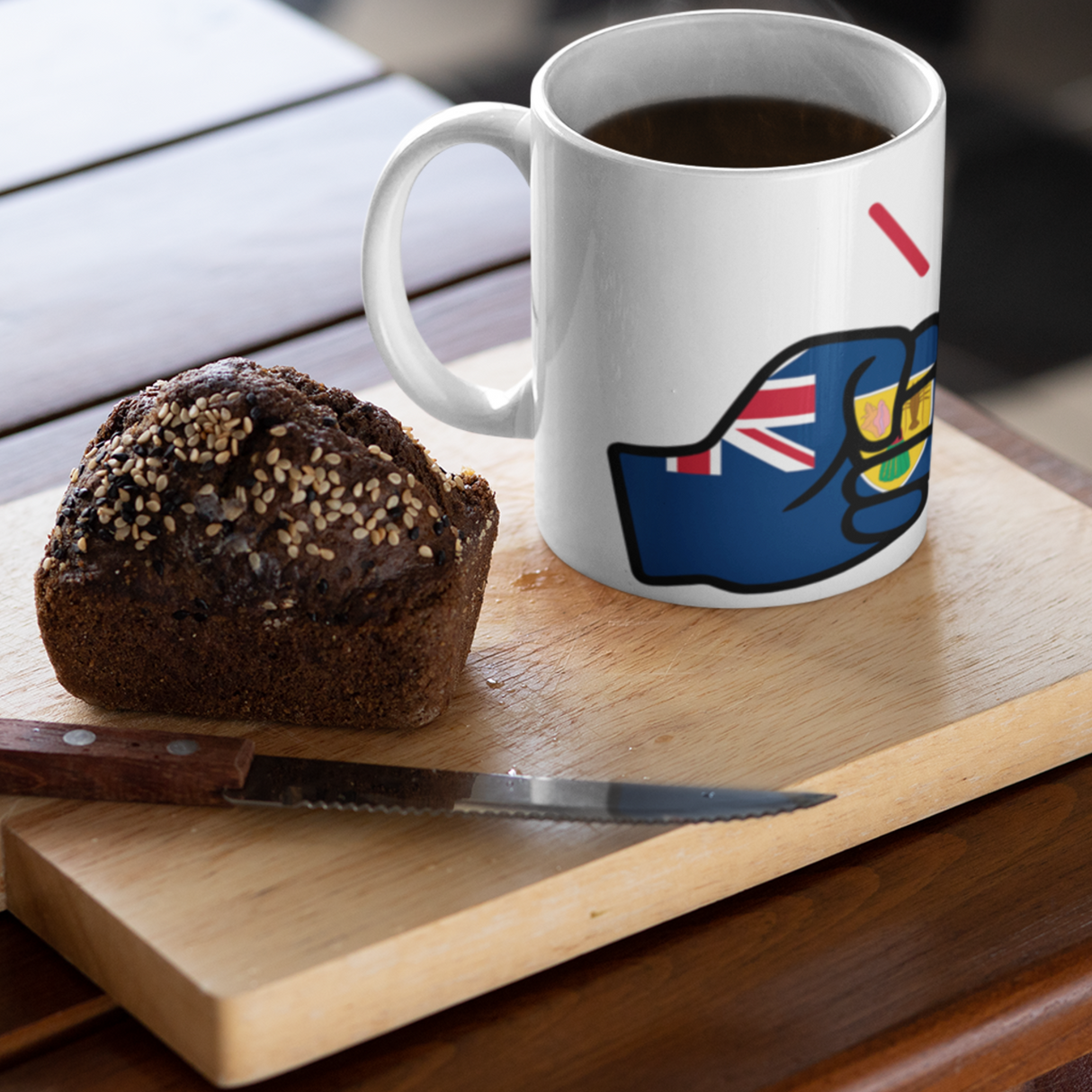 We Run Tings, Turks and Caicos, Caribbean Themed, Tea, Coffee White Ceramic Mug, Cup, 11oz Classic Drinkware Washable Reusable Reuse Tumbler Patriotic. Mug with a design on a wooden cutting board with a chocolate muffin and knife