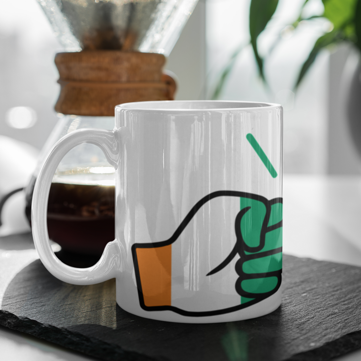 We Run Tings Cote d’Ivoire/Ivory Coast coffee Mug placed on a dark surface with a blurred background.