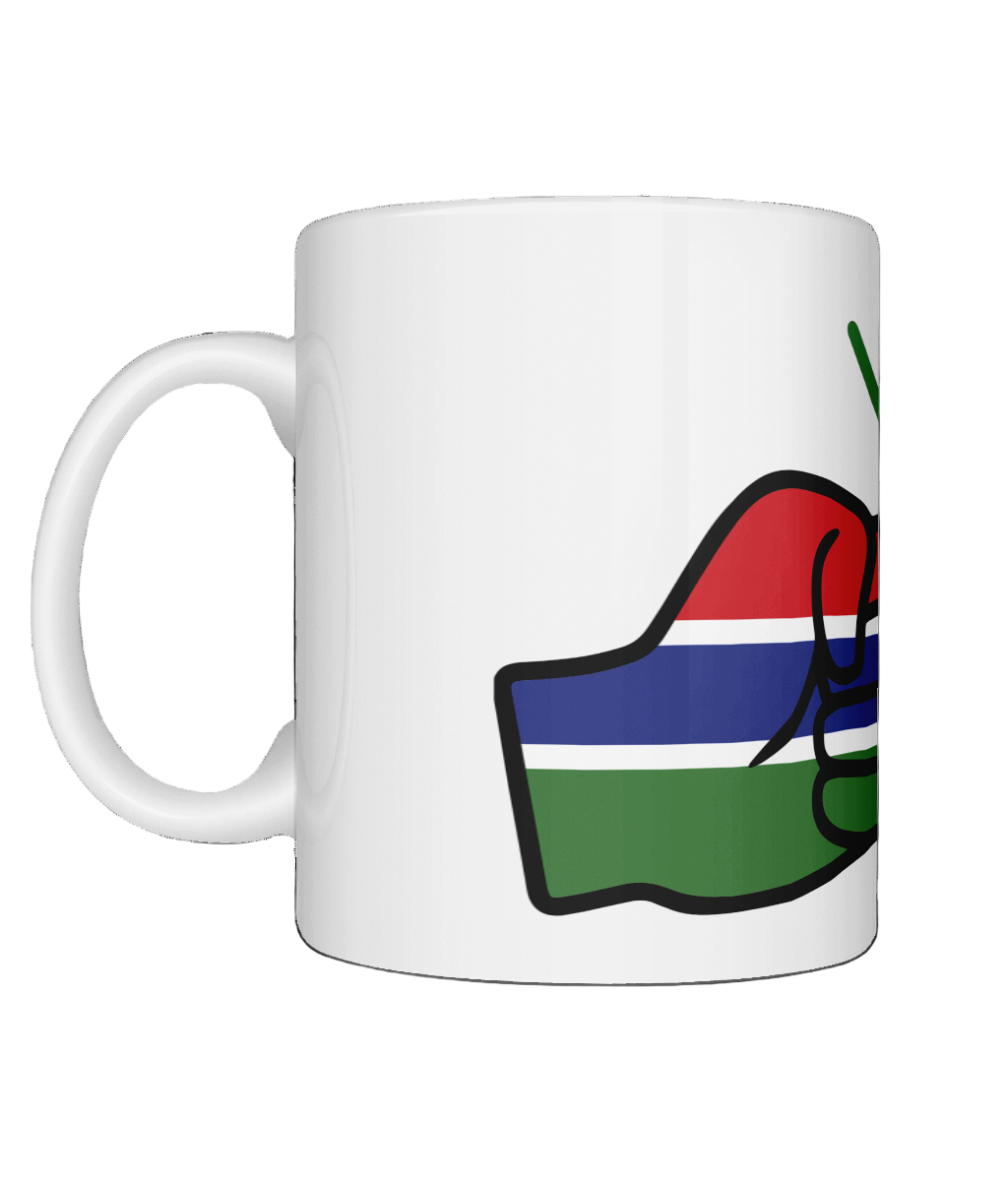 A glossy white ceramic mug with a graphic design of the flag of Gambia and the brand 'We Run Tings'. on a white background