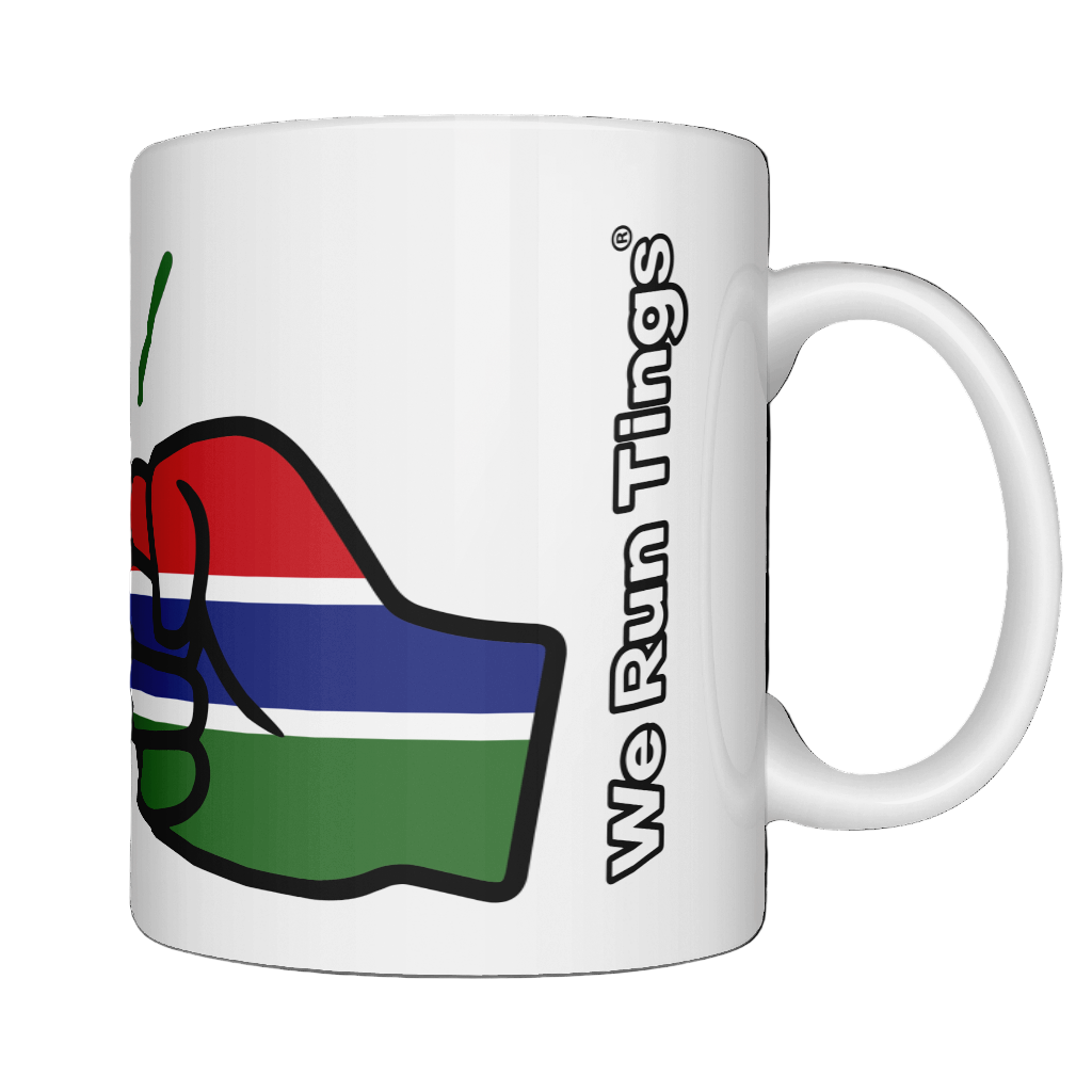 A glossy white ceramic We Run Tings Gambia Mug with a graphic design of a fist and the colors of the flag of Gambia. Front view
