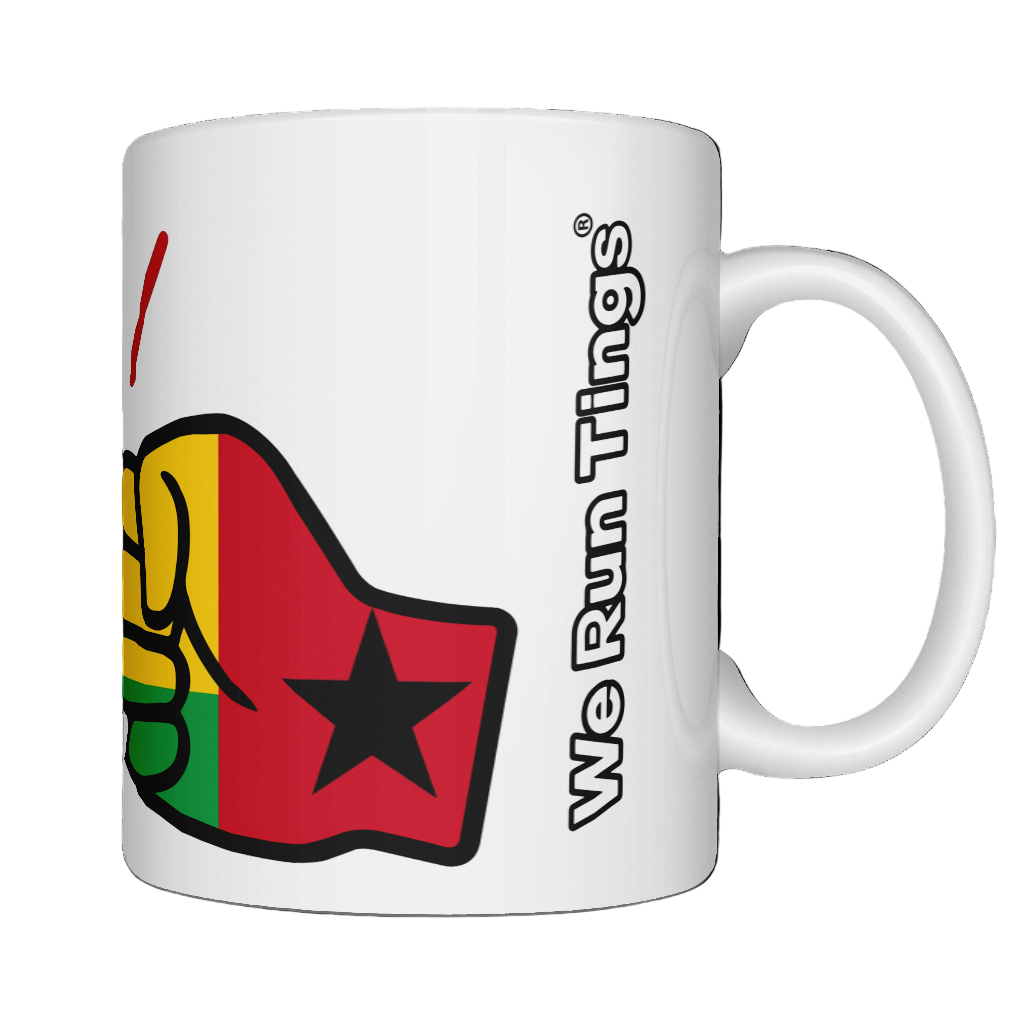 A glossy white ceramic We Run Tings Comoros Mug with a graphic design of a fist and the colors of the Guinea-Bissau flag and Brand name on the side. white background. Front view