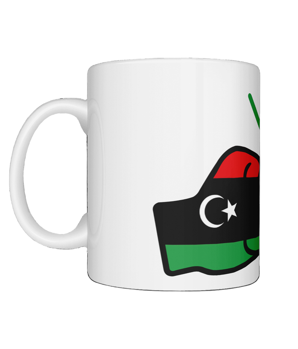 A glossy white ceramic mug with a graphic design of the flag of Libya and the brand logo of 'We Run Tings' on a white background. Side view.