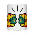 A white ceramic mug with a glossy finish featuring a graphic design of two hands making a peace sign, set against a yellow and green background with star motifs.