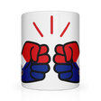 A glossy white ceramic mug with a graphic design of two clenched fists in red and blue colors, representing the St. Martin flag, and the We Run Tings logo.