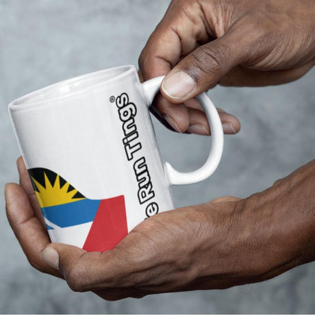 Image of man holding a We Run Tings Antigua white ceramic mug