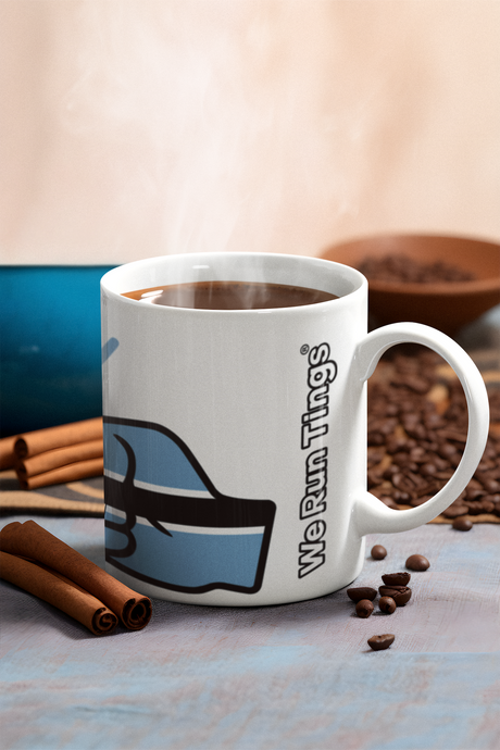 White We Run Tings coffee mug featuring the flag of Botswana with cinnamon sticks, and coffee beans on a light surface