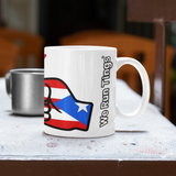 White mug with Puerto Rican flag design and 'We Run Tings' text on a table.