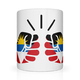 A white ceramic mug with the design of We Run Tings, Antigua and featuring colors of the Antiguan flag and a fist graphic.