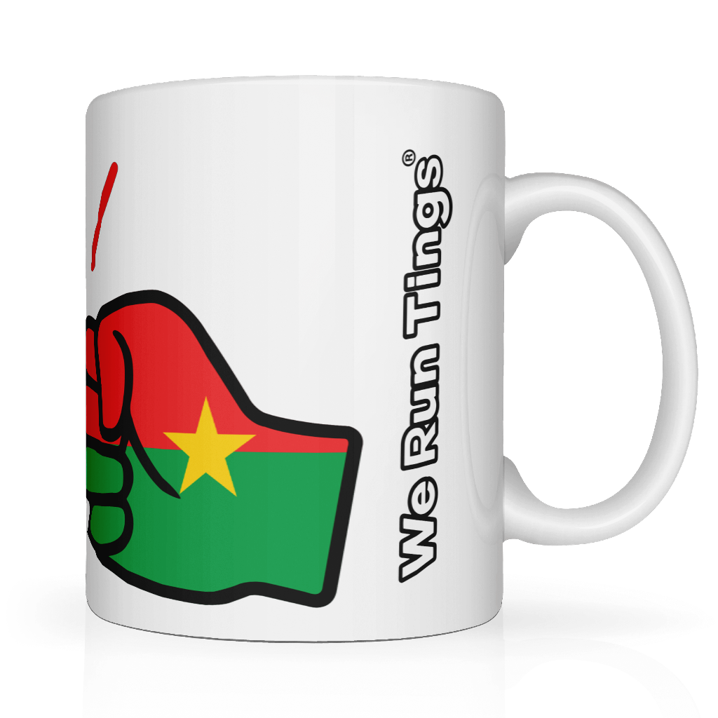 Side view. White mug with a graphic fist of the flag of Burkina Faso Mug. White ceramic glossy cup featuring the flag of Burkina Faso graphic and 'We Run Tings' text on a white background