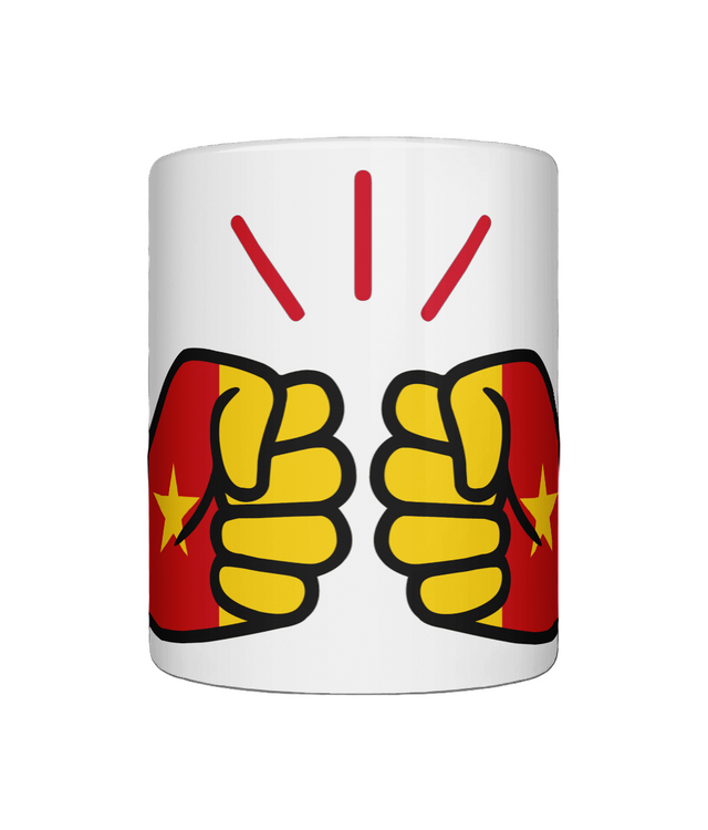 Glossy white ceramic mug featuring a patriotic We Run Tings logo with two fists displaying the flag of Cameroon. Front view