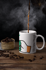 White We Run Tings Cote d’Ivoire/Ivory Coast Mug with a brand logo being filled with steaming coffee, surrounded by coffee beans on a wooden surface.