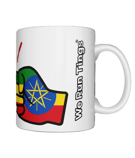 A glossy white ceramic mug with a graphic design of Ethiopia flag and the brand 'We Run Tings' on a white bakground.
