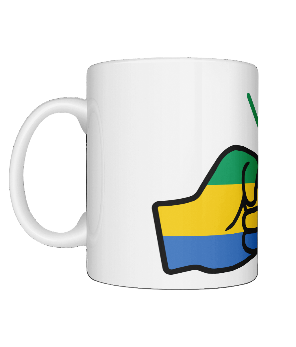 A glossy white ceramic We Run Tings Gabon Mug with a graphic design of a fist and the colors of the flag of Gabon. On a white background. Side view.