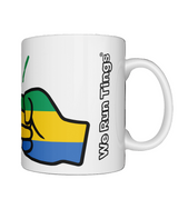A glossy white ceramic mug with a graphic design of the Gabon flag and the brand logo 'We Run Tings'. On a white background.
