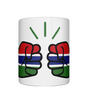 Glossy white ceramic mug featuring a patriotic We Run Tings logo with two fists displaying the flag of Gambia on a white background.