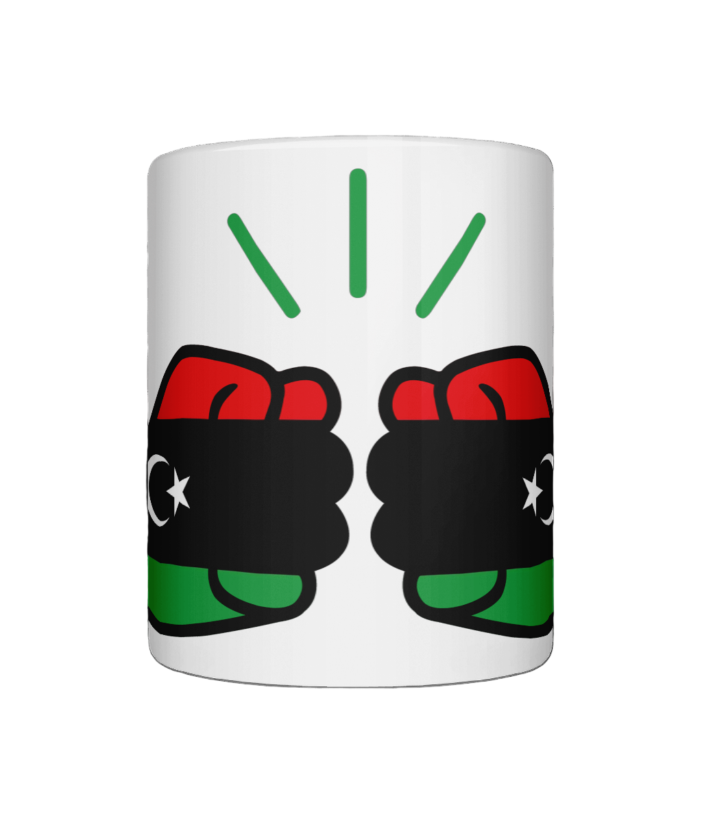 A glossy white ceramic mug We Run Tings Libya mug with a graphic design featuring clenched fists and the colours of the Libyan flag. Front view on a white background