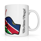 We Run Tings, Namibia Mug, 11oz / 313ml premium ceramic mug. Glossy white finish for a sleek, modern look. Comfortable easy-grip handle. Suitable for hot and cold beverages. Side view showing the brand name We Run Tings.