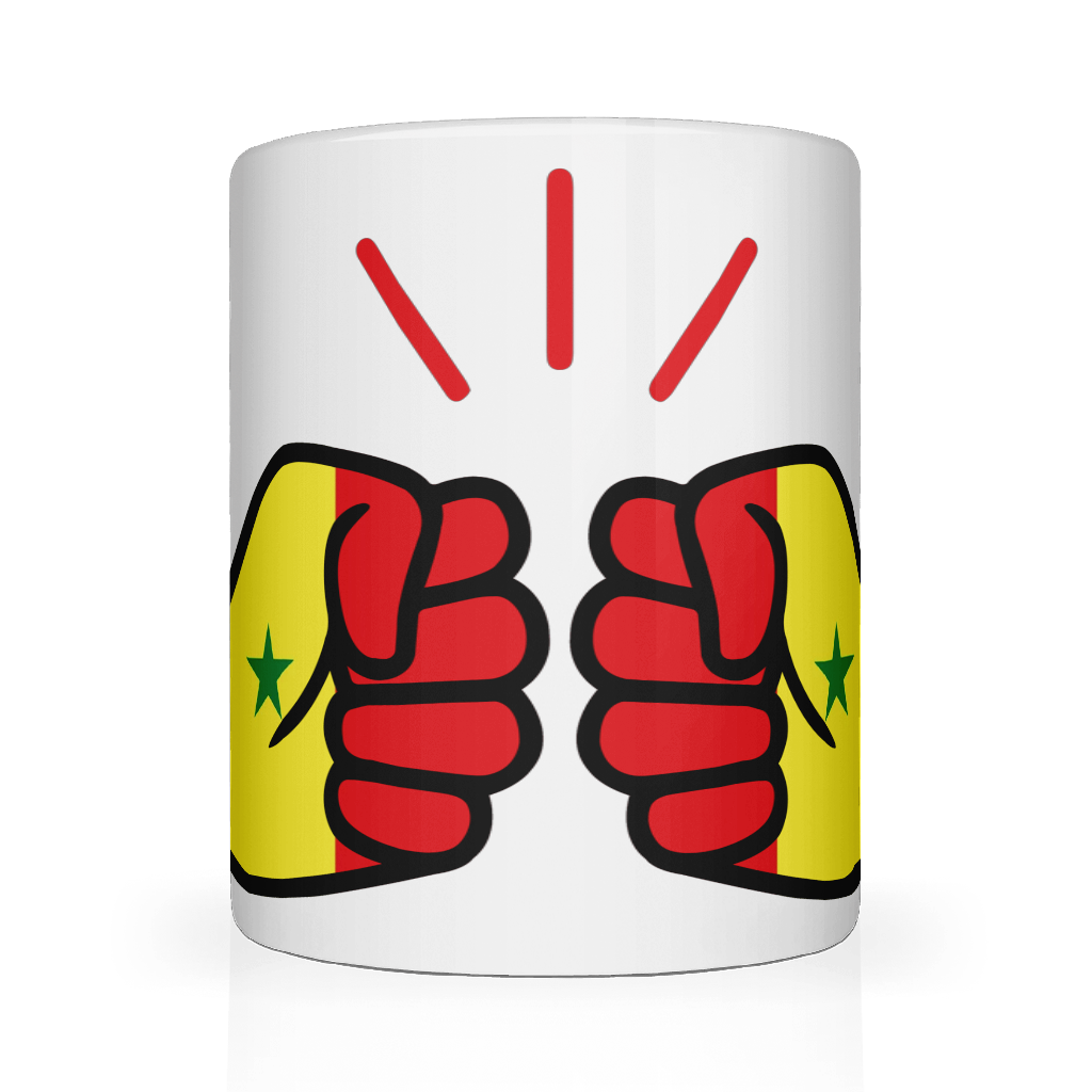 A glossy white ceramic mug with a hand-painted design featuring a fist and the text 'We Run Tings' in a bold, red and yellow color scheme representing the African country of Senegal