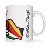 White glossy ceramic mug with colorful flag of Seychelles within the We Run Tings graphic logo and 'We Run Tings' text on on the side.