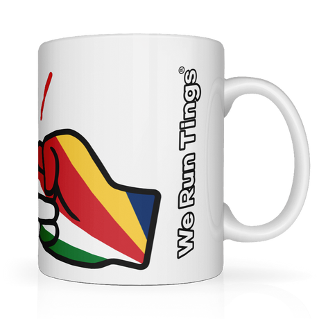 White glossy ceramic mug with colorful flag of Seychelles within the We Run Tings graphic logo and 'We Run Tings' text on on the side.