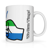 Side view of a glossy white ceramic coffee, tea mug with a graphic design of a fist featuring the We Run Tings Logo and the colours of the Sierra Leone flag, indicating a theme or message related to the country. Side view