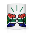A glossy white ceramic We Run Tings, South Africa mug with a graphic design of two clenched fists and the South African flag. Front view.