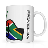 White ceramic mug with a graphic of the flag of South Africaa and 'We Run Tings' text on a white background. Side view