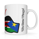 White ceramic mug with a colorful design of the flag of South Sudan and 'We Run Ting's' text on a white background