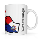 We Run Tings, St Martin White ceramic mug with a colorful design and 'We Run Tings' text on a white background. Side view