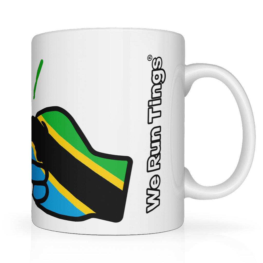 White We Run Tings, Tanzania tea, coffee ceramic mug, cup featuring the flag of Tanzania within the We Run Tings fist logo on a white background. Side view showing the wording of the brand name