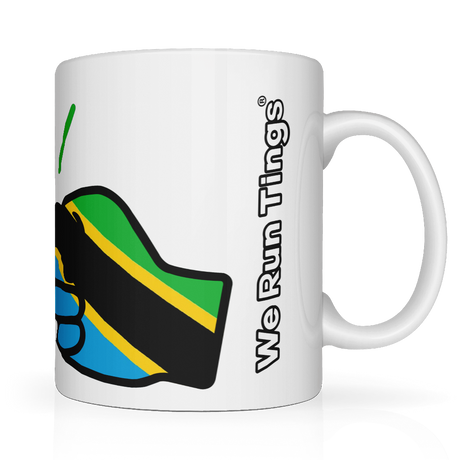 White We Run Tings, Tanzania tea, coffee ceramic mug, cup featuring the flag of Tanzania within the We Run Tings fist logo on a white background. Side view showing the wording of the brand name