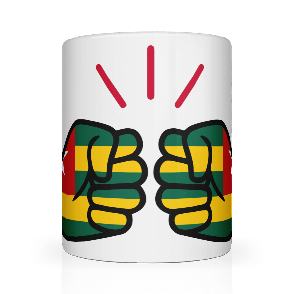 White ceramic mug featuring a bold “We Run Tings” design with two raised fists wrapped in the Togo flag colors, accented by red graphic lines above, symbolizing strength, unity, and cultural pride.