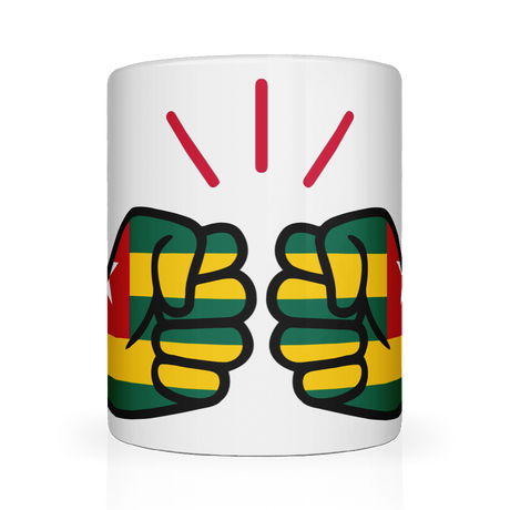 White ceramic mug featuring a bold “We Run Tings” design with two raised fists wrapped in the Togo flag colors, accented by red graphic lines above, symbolizing strength, unity, and cultural pride.