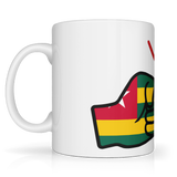 White ceramic mug featuring a bold “We Run Tings” design with two raised fists wrapped in the Togo flag colors, accented by red graphic lines above, symbolizing strength, unity, and cultural pride. Side view on a white background