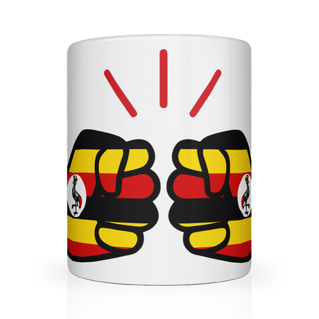 A glossy white ceramic We Run Tings, Uganda tea, coffee mug with a graphic design of clenched fists in yellow, red, and black colors, representing the 'We Run Tings' brand.