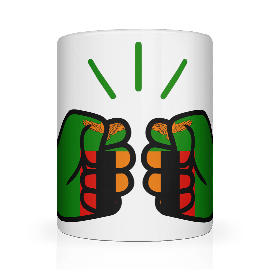 A white We Run Tings, Zambia ceramic mug with a graphic design of a fist holding a tea bag, surrounded by a green and red pattern. Front view
