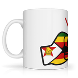 White glossy ceramic We Run Tings, Zimbabwe tea, coffee mug with a colorful design featuring a lion and a shield on a white background