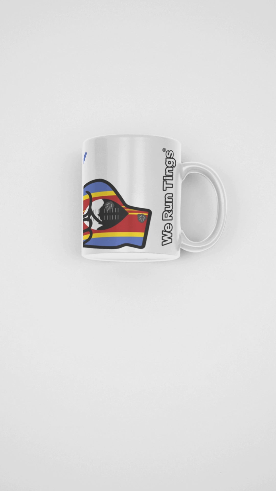 Presentation video showcasing a glossy white ceramic mug featuring a patriotic We Run Tings logo with two fists displaying the flag of Eswatini
