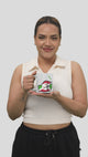 Woman smiling holding a We Run Tings Burundi themed coffee mug on a white background